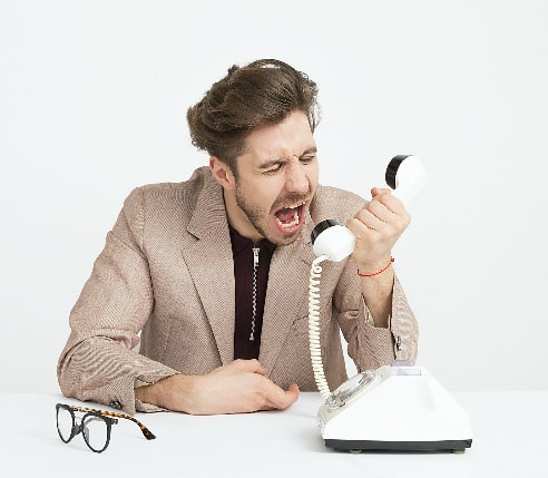 A man shouting at the phone