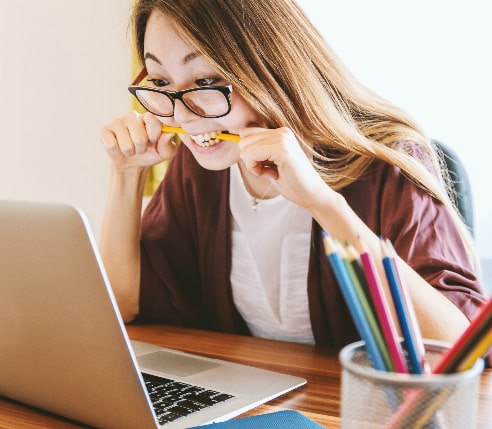 A woman studying on her laptop