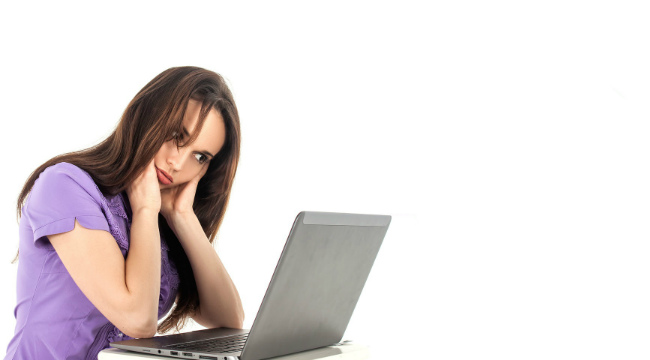 A woman studying on her laptop